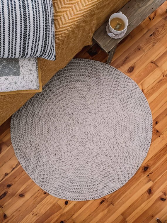 Round beige carpet for the living room