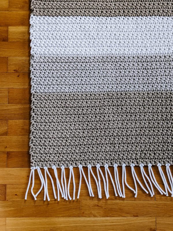 Crochet striped carpet in beige tones