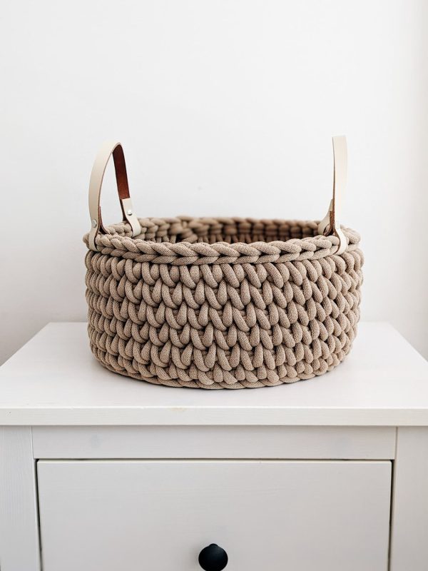 Beige crocheted storage basket with handles