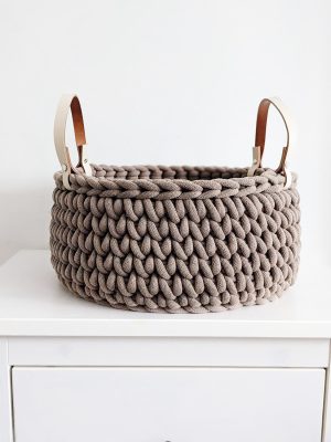 Brown crocheted storage basket with handles