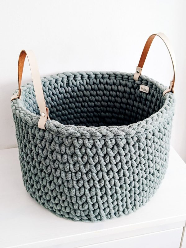 Green crocheted storage basket with handles
