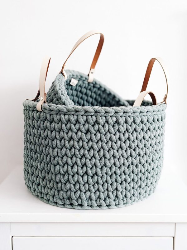 Green crocheted storage basket with handles