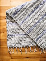 Crocheted beige with lila stripes rug